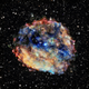 The luminous remains of a supernova seen in a composite X-ray and optical light image.